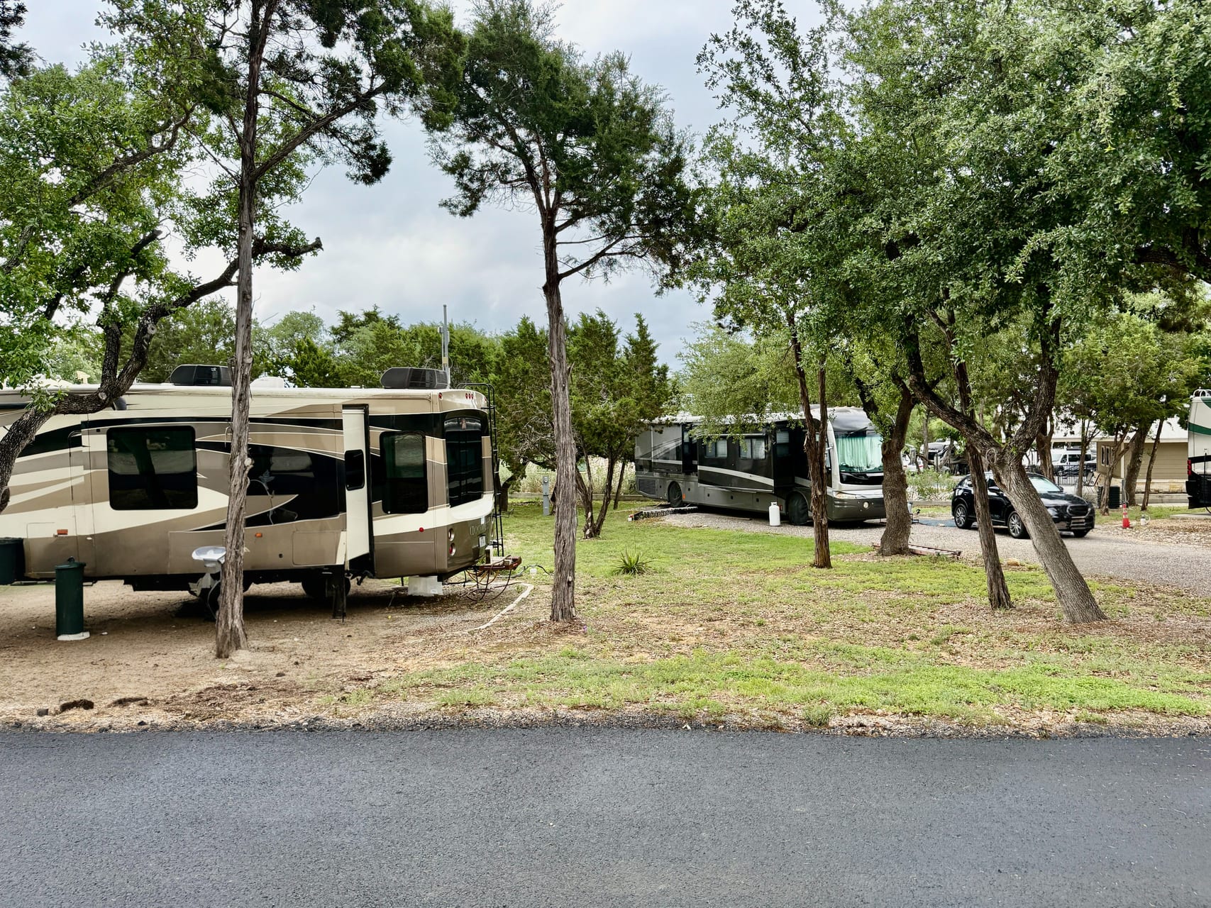 Shaded RV Parking Under Oaks — Sienna Ridge RV Park, Canyon Lake, Texas